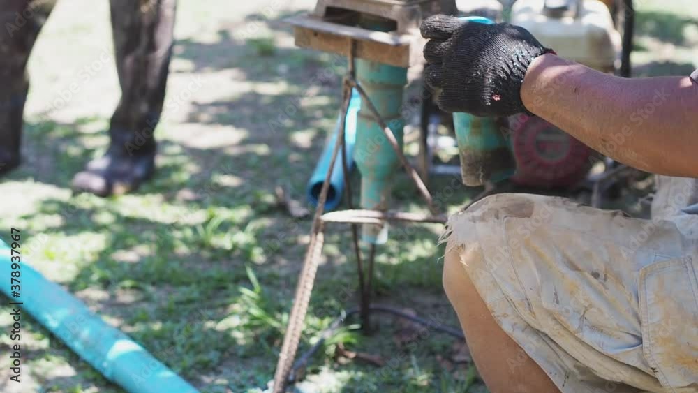 Closeup of workers are using saws to cutting pipe for using drilling