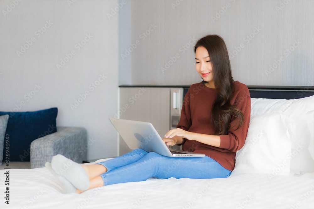 Portrait beautiful young asian woman use computer laptop on bed Portrait beautiful young asian woman use computer laptop on bed