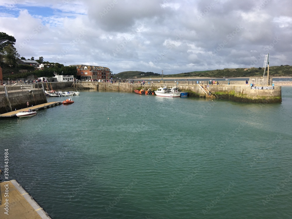 A view of Padstow Harbour in Cornwall showing the fishing boats in the evening