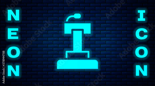 Glowing neon Stage stand or debate podium rostrum icon isolated on brick wall background. Conference speech tribune. Vector.