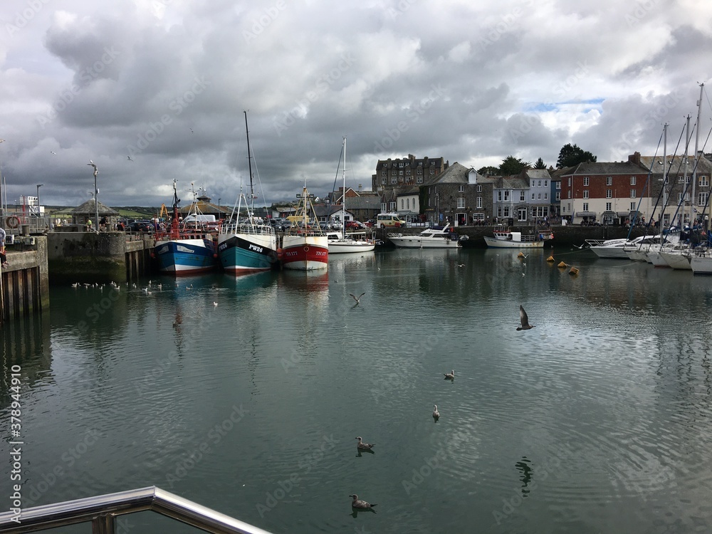 A view of Padstow Harbour in Cornwall showing the fishing boats in the evening