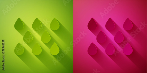 Paper cut Water drop icon isolated on green and pink background. Paper art style. Vector.