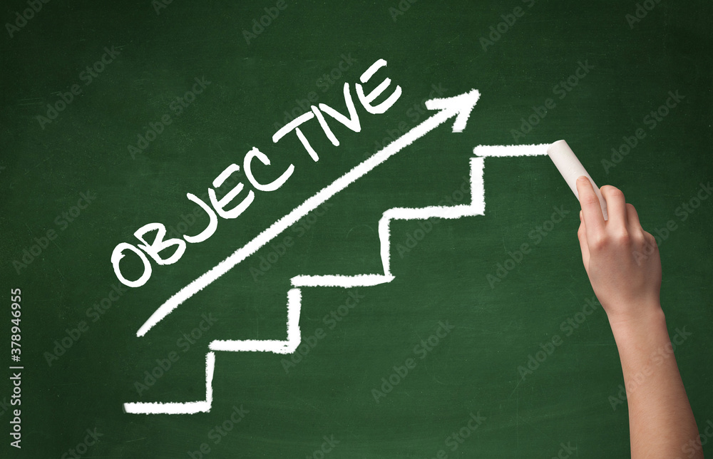 Hand drawing OBJECTIVE inscription with white chalk on blackboard, business concept Hand drawing OBJECTIVE inscription with white chalk on blackboard, business concept