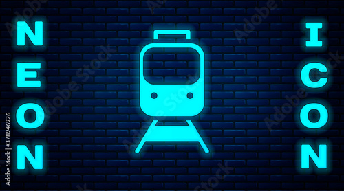 Glowing neon Train and railway icon isolated on brick wall background. Public transportation symbol. Subway train transport. Metro underground. Vector.