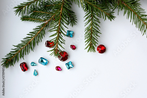 Blue and red rhinestones for needlework on a white background. New Year s decor.