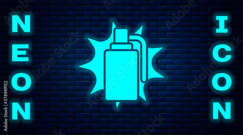 Glowing neon Hand grenade icon isolated on brick wall background. Bomb explosion. Vector.