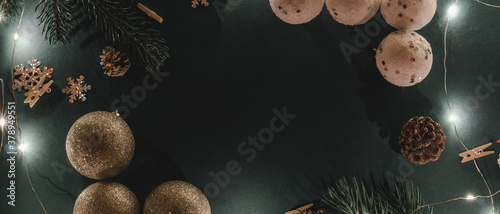 Background banner of Christmas toys and garlands with place for text. Christmas nof top view. photo