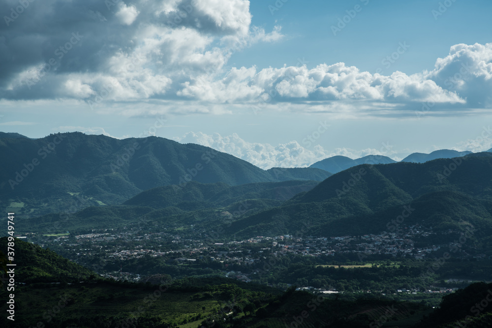 dramatic sunlit image of the caribbean mountains of dominican republic, san jose de ocoa. and taton mountainside.