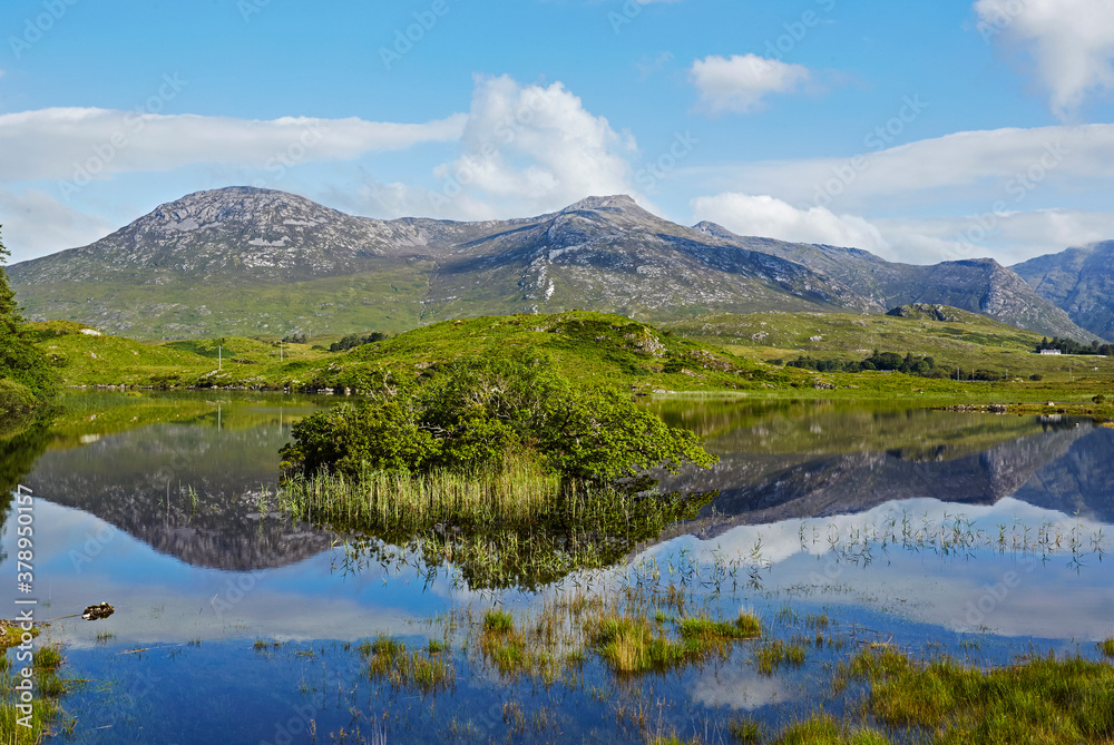Awe inspiring landscape and lake reflecting Connemara National Park in Ireland
