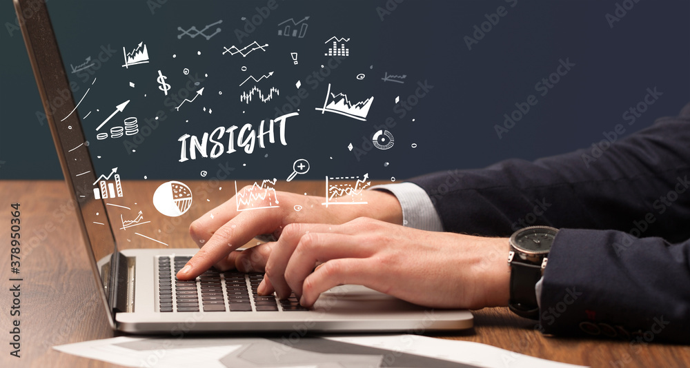 Businessman working on laptop with INSIGHT inscription, modern business concept Businessman working on laptop with INSIGHT inscription, modern business concept