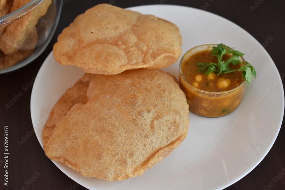 oil fried puffed poori with chana masala indian cuisine oil fried puffed poori with chana masala indian cuisine