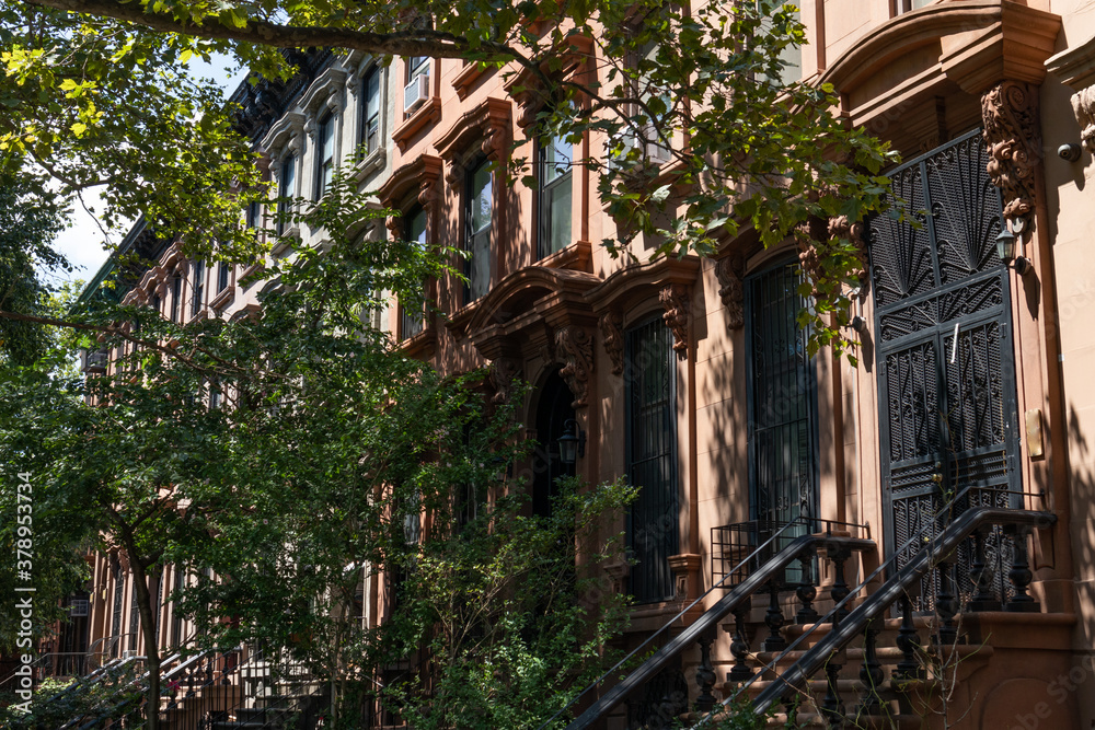 Row of Old Brownstone Homes in Clinton Hill in Brooklyn of New York City with Staircases