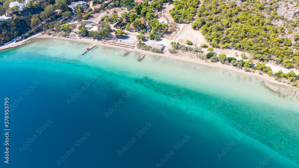 Aerial view on turqouise blue water and sandy beach of Limni Vouliagmeni or Ireon Lake, Peloponnese, Greece  