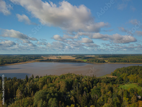Aerial landscape, countryside, lake, forest and fields. Landscape of Finland, Scandinavia. September drone photo