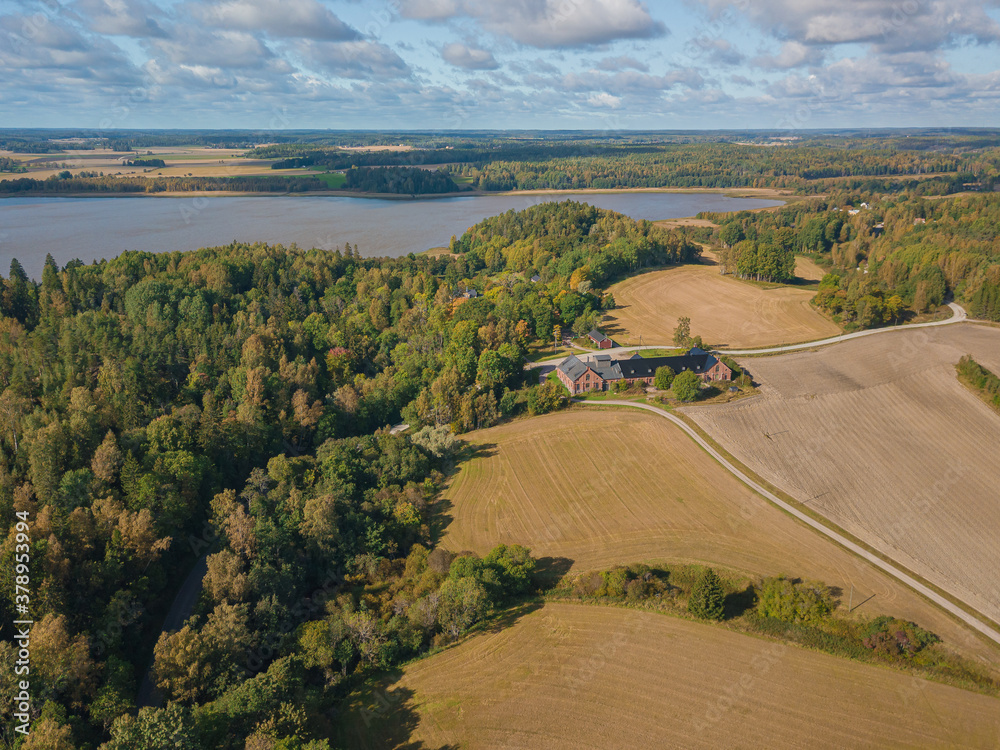 Aerial landscape, countryside, lake, forest and fields. Landscape of Finland, Scandinavia. September drone photo