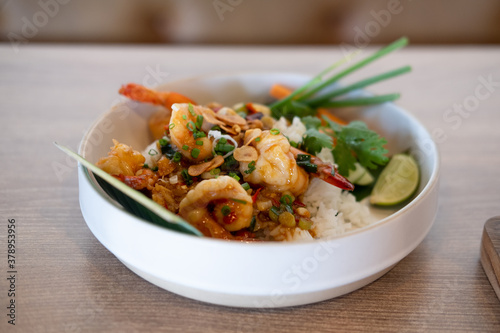Rice with fried shrimp and garlic in bowl, Thai recipe.