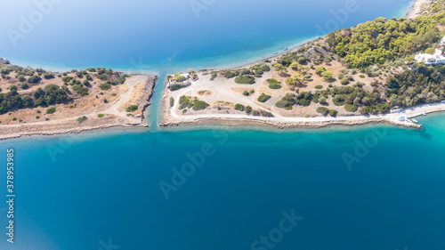 Fototapeta Naklejka Na Ścianę i Meble -  Aerial view on turqouise blue water and sandy beach of Limni Vouliagmeni or Ireon Lake, Peloponnese, Greece  