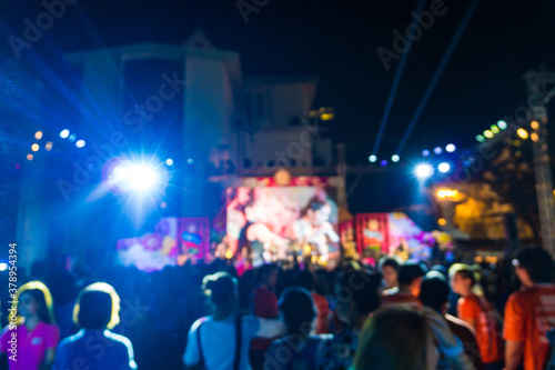 Crowd at concert and blurred colorful stage lights festival Event