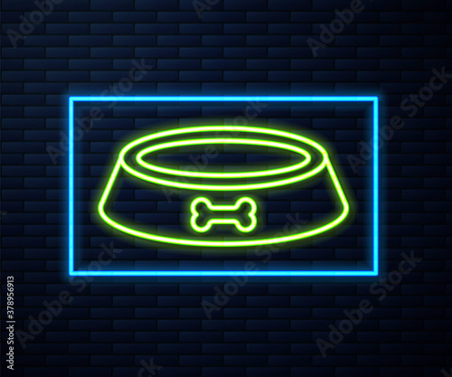 Glowing neon line Pet food bowl for cat or dog icon isolated on brick wall background. Dog bone sign. Vector.