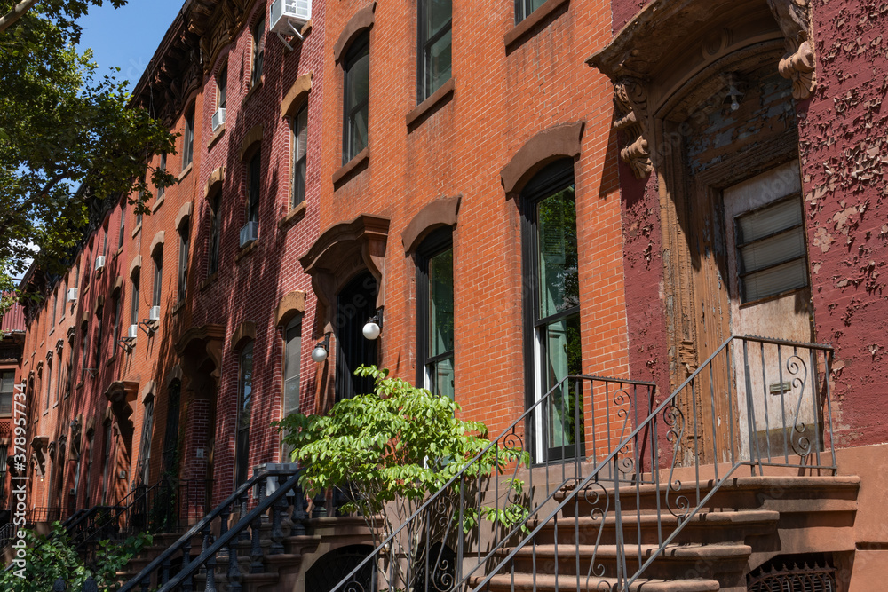 Row of Old Brownstone Homes in Clinton Hill in Brooklyn of New York City with Staircases