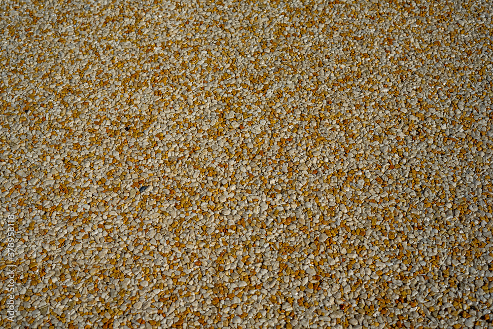  Tiny gravel texture on brown concrete wall. Texture background seamless gravel floor.