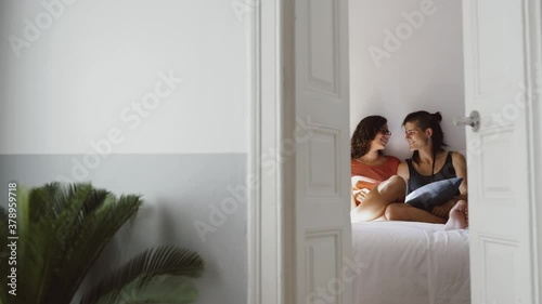 A couple of two lesbian girls enjoy and relax at home 