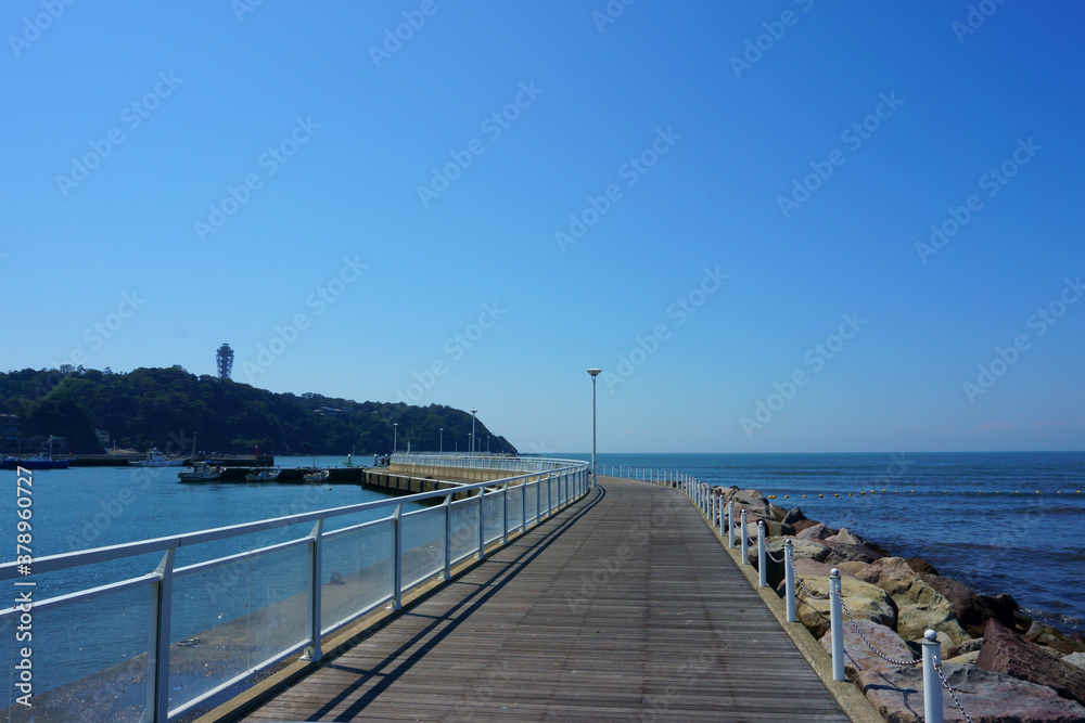 Blue sky and sea, pier. Enoshima Island in the background
