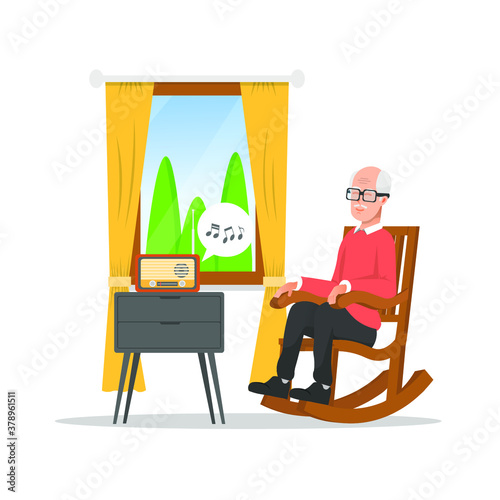 Old man sitting in a rocking chair listening to the radio