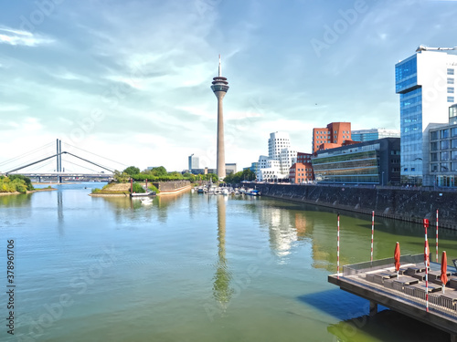 Television tower at the Media harbor in duesseldorf with facades and blue sky