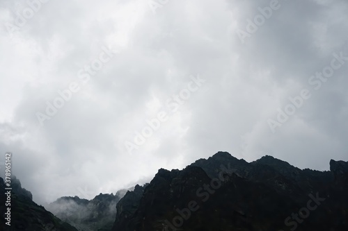  The peaks of the High Tatras with white clouds. Mountains in the clouds. High Tatras Mountains in Slovakia © Art Johnson