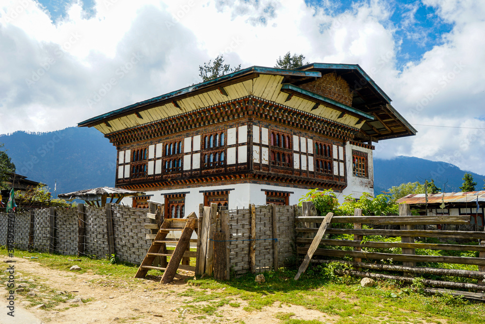 Bhutan, traditional farm house in the countryside with beautiful wooden decoration