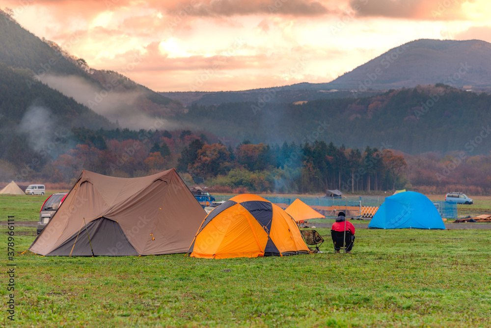 Tents Camping area, early morning with sunrise, beautiful natural place near the mountain and pine forest.