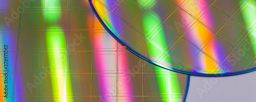 Macro of blue silicon wafer with microchips. Banner format.