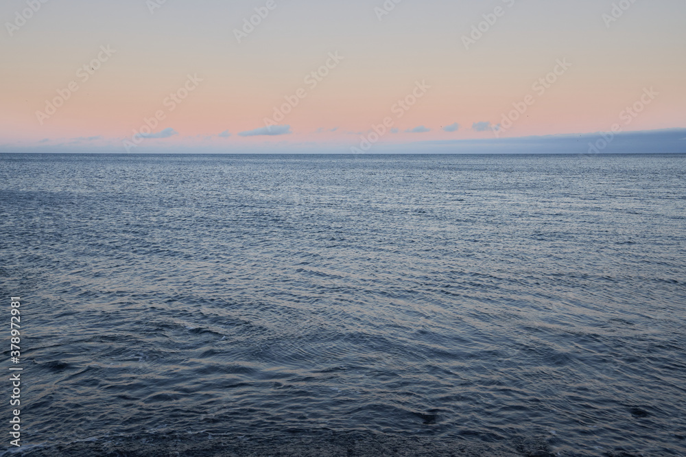 Beautiful sunrise over the sea water of Djupalonssandur beach on the island of Iceland