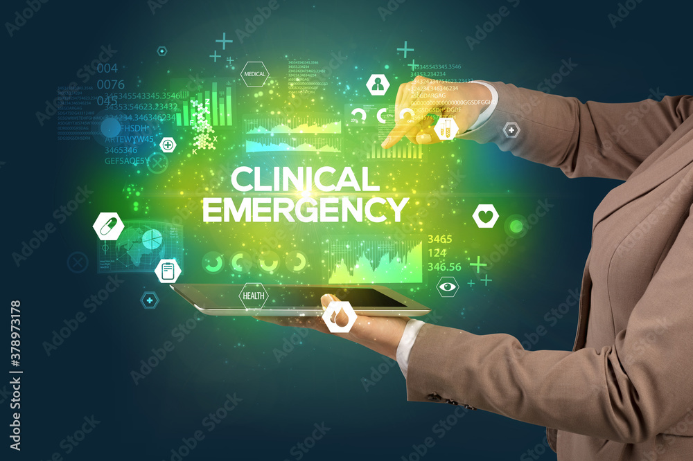 Close-up of a touchscreen with CLINICAL EMERGENCY inscription, medical concept Close-up of a touchscreen with CLINICAL EMERGENCY inscription, medical concept