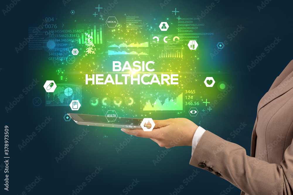 Close-up of a touchscreen with BASIC HEALTHCARE inscription, medical concept Close-up of a touchscreen with BASIC HEALTHCARE inscription, medical concept