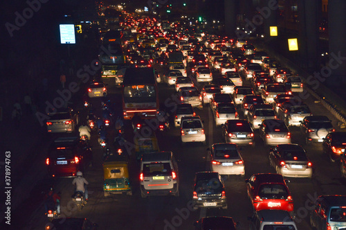 A view of traffic jam at night from the rooftop of bridge.