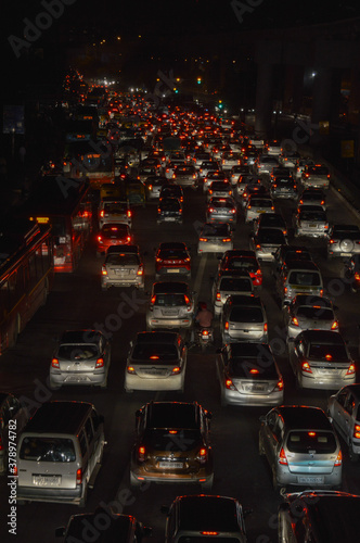 A night life view of polluted city, which is jammed because of huge traffic on road.
