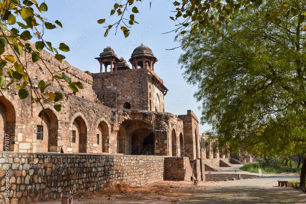 A mesmerizing view of architecture of small tomb at old fort from side lawn.