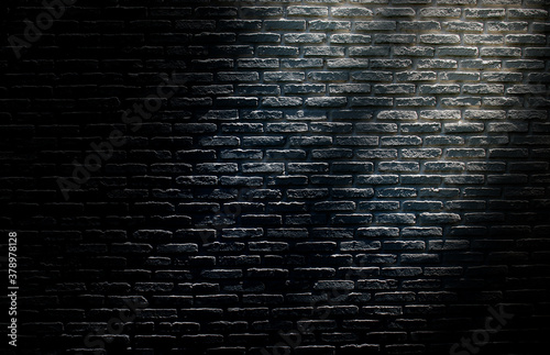 Abstract image of Sunlight shading shadow on empty space black brick wall grunge texture background.