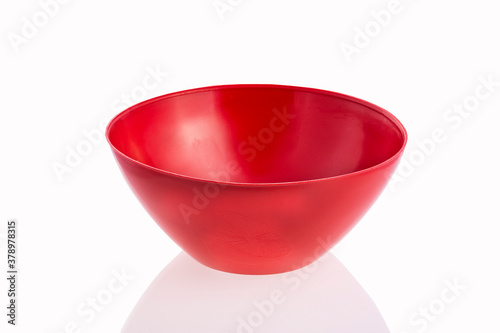 Red plastic plate for food and salad - White background