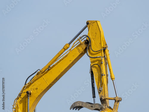 Wallpaper Mural detail of a yellow hydraulic bucket boom arm of a construction digger Torontodigital.ca