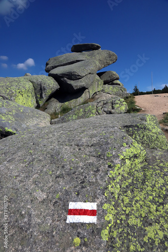 Twaroznik or Tvaroznik (in Polish and Czech) is a large granite rock, 12,5 m high, with a characteristic flat block at the top, on the border between Poland and the Czech Republic. photo