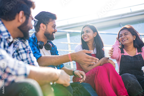 infian best friends spending time together outdoors in spring park photo