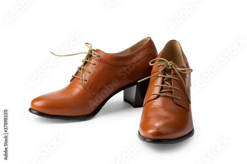 women's brown high-heeled shoes with laces, isolate on a white background