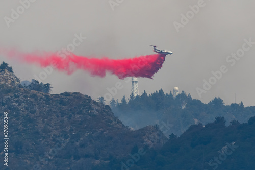Tanker making a drop in front of Mt. Wilson to fight the Bobcat Fire
