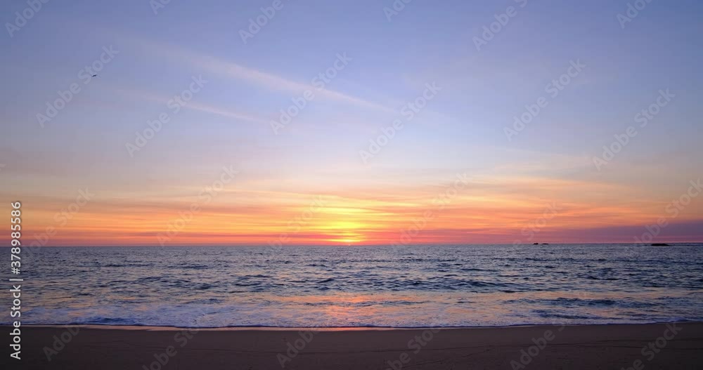 Beautiful blue / orange gradient sky at sunset on the beach with thin wispy clouds. Beautiful blue / orange gradient sky at sunset on the beach with thin wispy clouds.