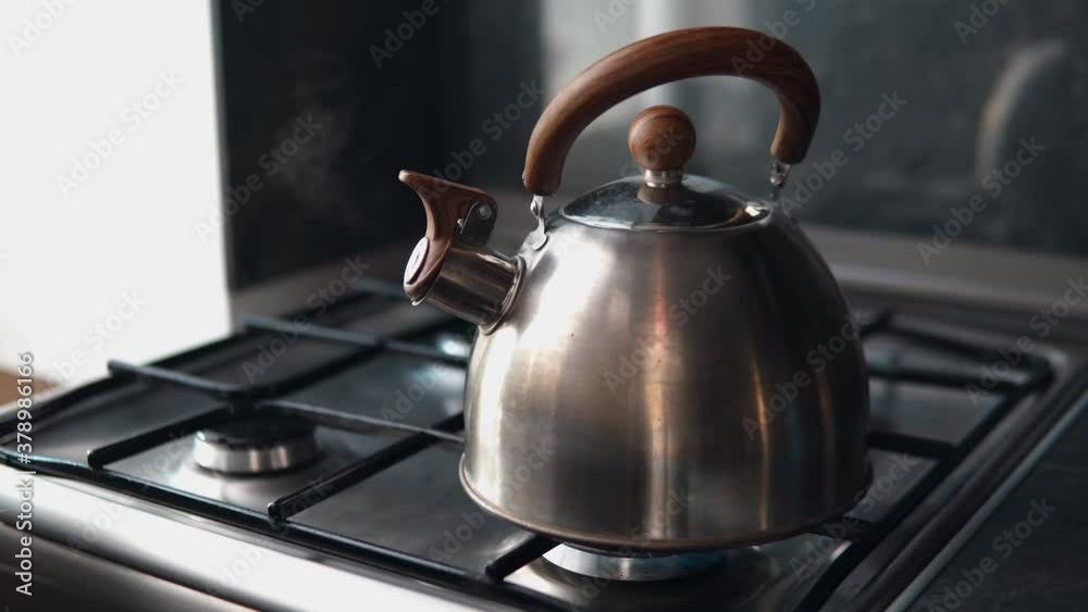 boiling a kettle on a gas stove boiling a kettle on a gas stove