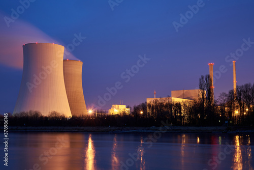 Atomkraftwerk Philippsburg mit zwei Kühltürmen und dem Rhein im Vordergrund photo