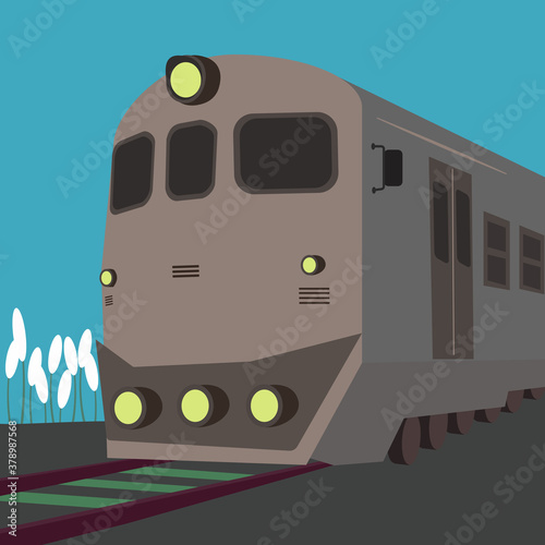 A train on the rails in the blue background
